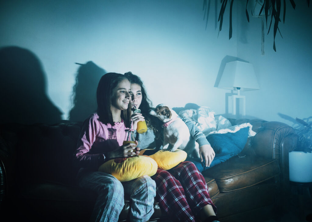 laughing-girls-with-dog-watching-tv