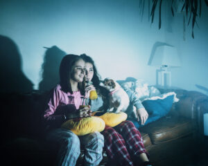 laughing-girls-with-dog-watching-tv